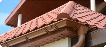 Inicio 11 Top Tejados Avila tiled roof against blue sky with clouds idea background with space text ecofriendly traditional roofs home 1 - Top Tejados Avila